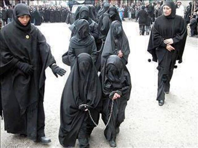 Muslim girls being lead off in chains